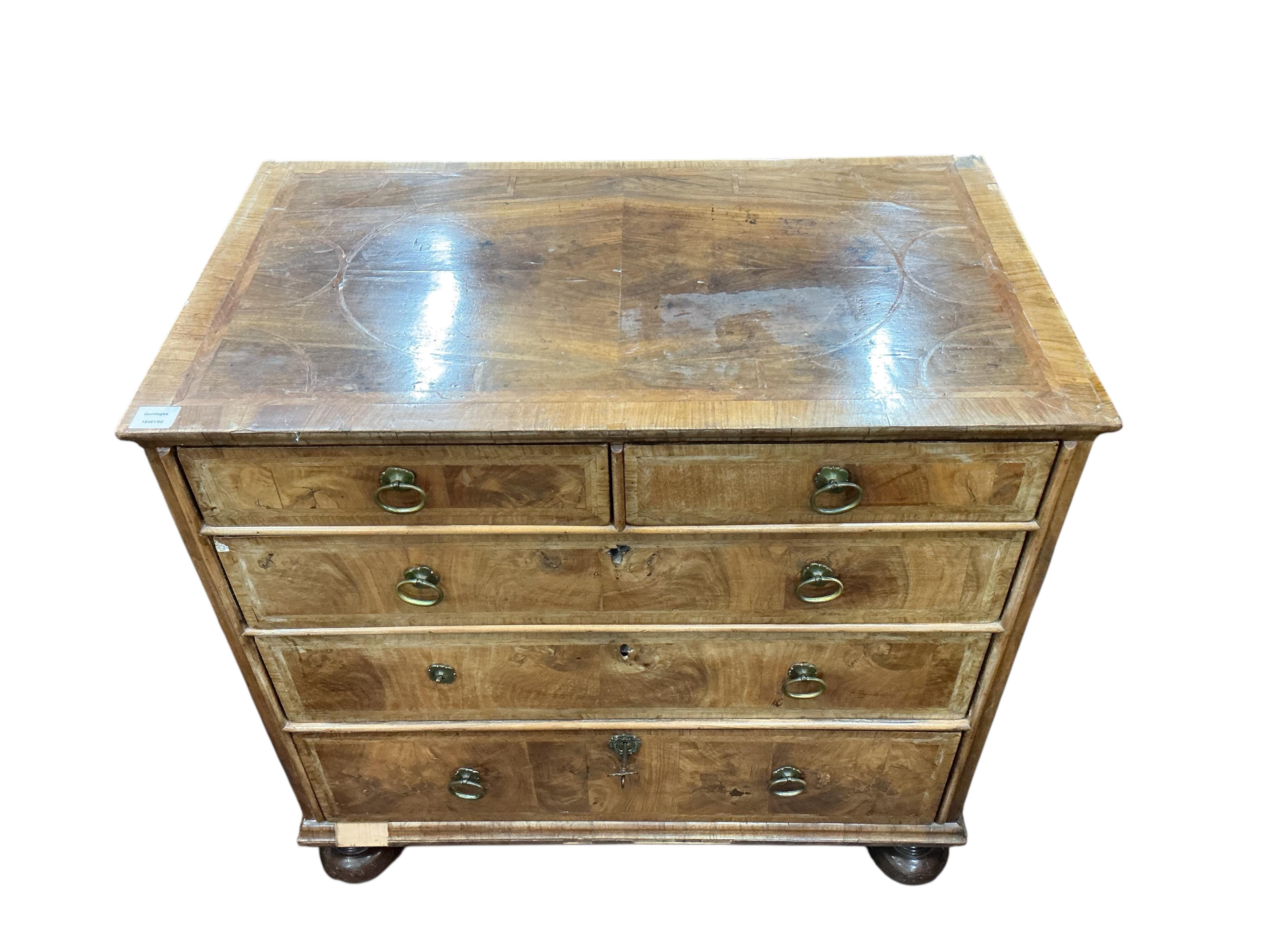 An early 18th century feather banded walnut chest, damaged, width 95cm, depth 54cm, height 91cm